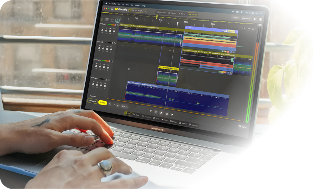 A person using DJ Studio to transition between multiple tracks.