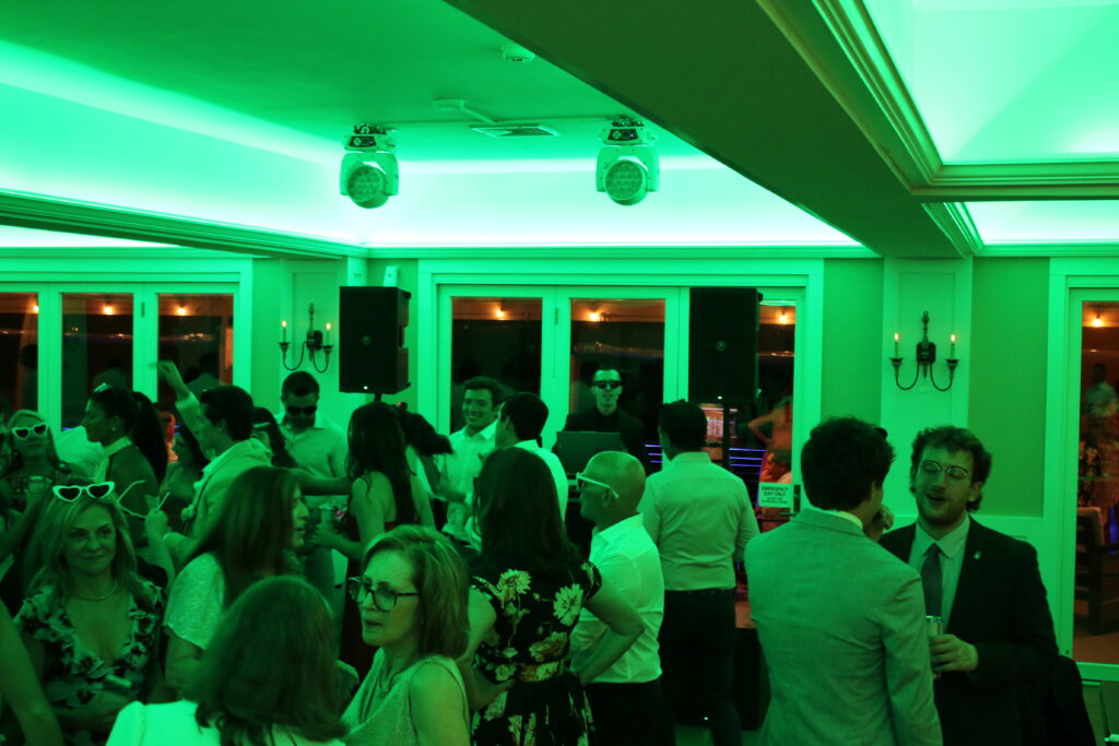 DJ booth with lights and crowd reacting to dancefloor fillers and killers.
